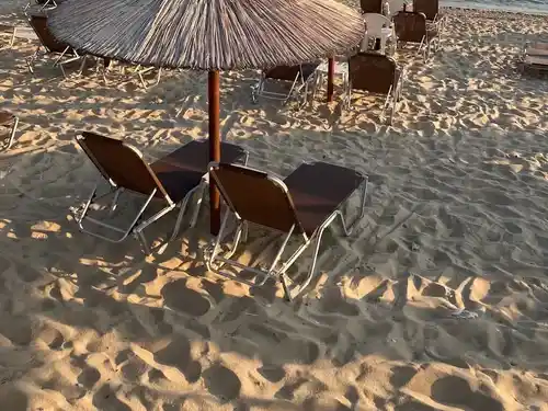 paralia ofrinio straw umbrellas sun loungers beach