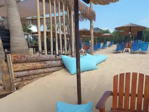paralia ofrinio beach bar pillows poufs and awnings